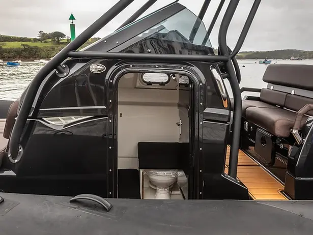 Boat cabin interior with head and seating