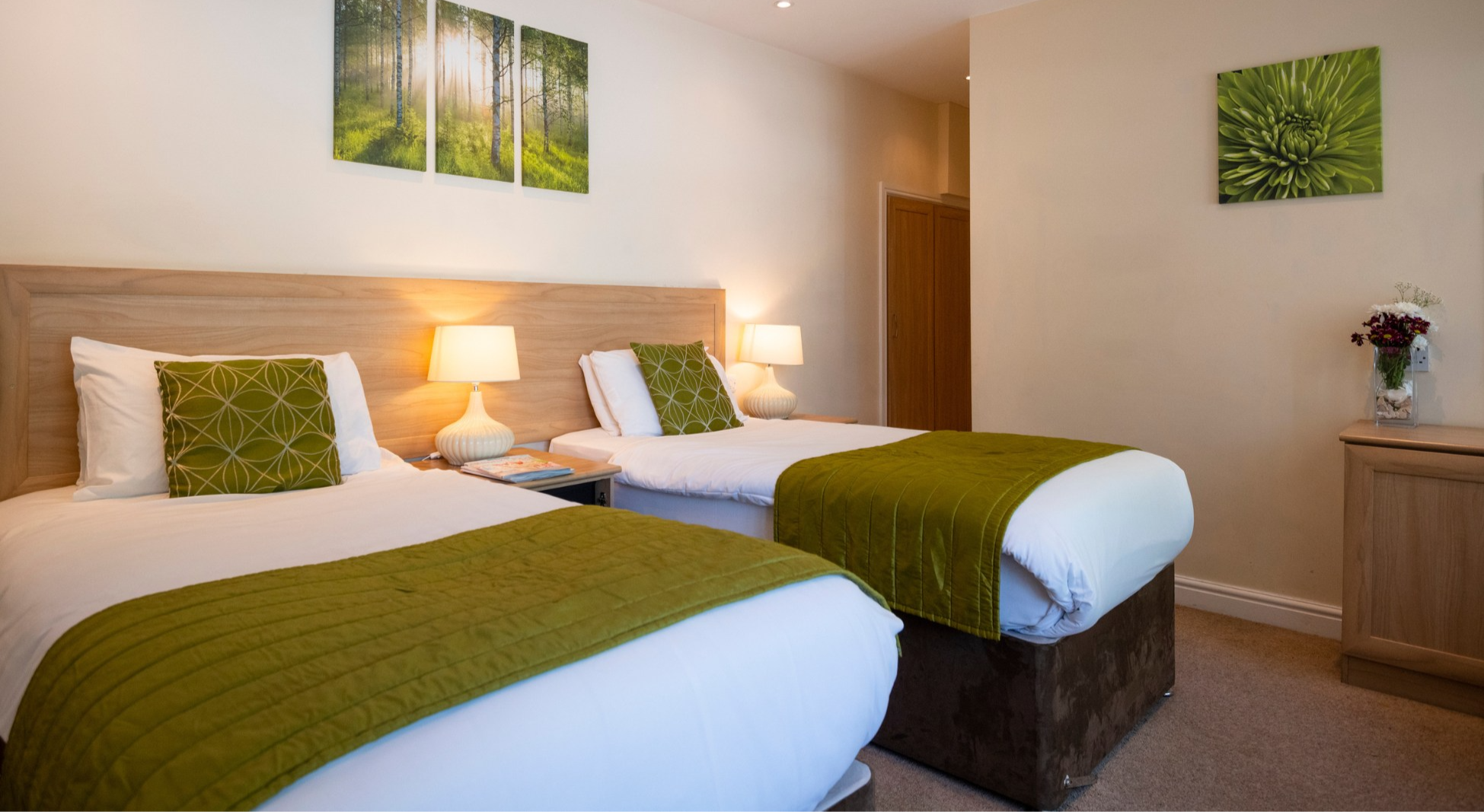 Twin beds in a bright hotel room