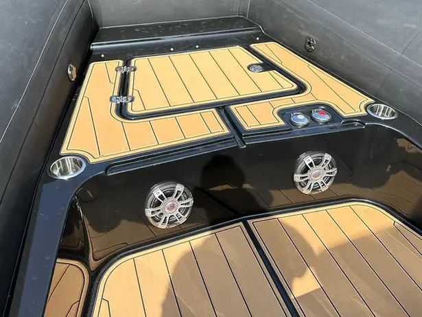 Boat deck with faux teak flooring, speakers, cup holders