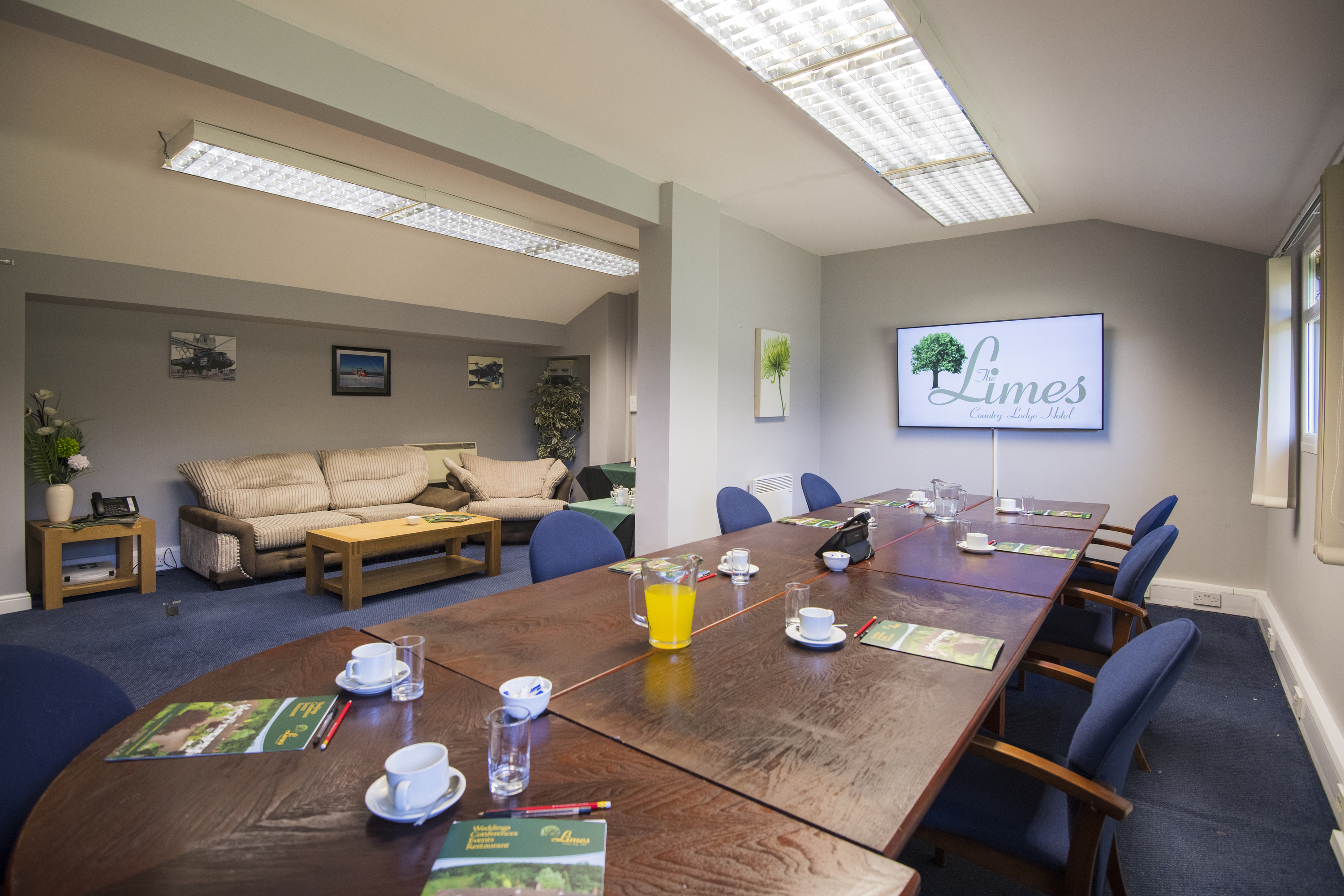 The Limes meeting room: long table, seating, and lounge area