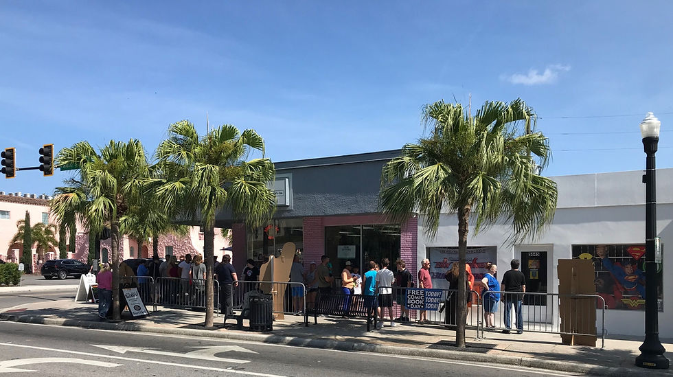 Crowds of people lineup outside Six Strings & Superheroes in downtown New Port Richey for "Free Comic Book Day".