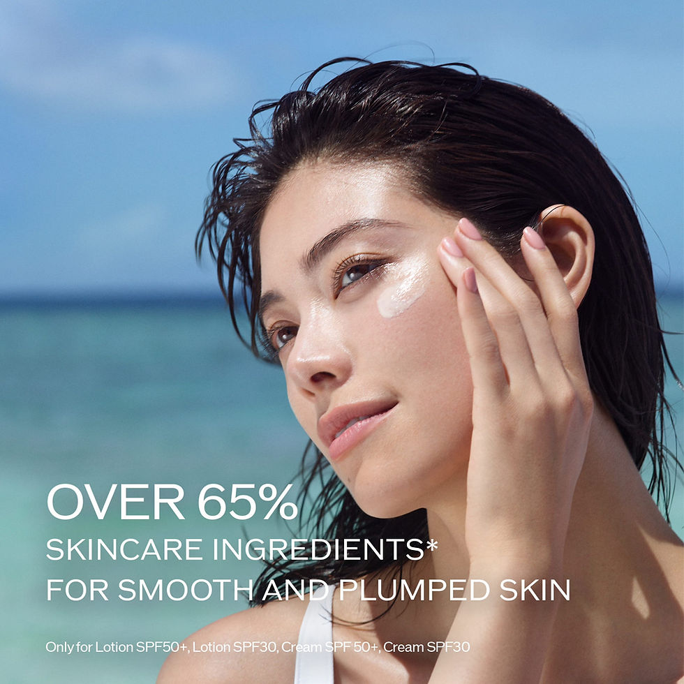 Woman applying cream on face by the ocean, text reads "Over 65% skincare ingredients for smooth and plumped skin." Calm and serene mood.