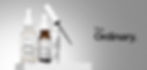 Skincare bottles from The Ordinary on white surface with gray background. Includes serums and eye treatment bottles with visible text.