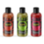 Three bottles of Vadasz sauce: Hot Pepper, Jalapeño, and Kimchi Ketchup. Each has vibrant colored labels with decorative patterns.