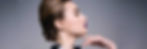 2025 GLOBAL TRENDS: Beauty and Personal Care DiMotta Strategic Adriana Motta. Profile of a woman with elegant bun, bold purple lipstick, and black eyeliner, posing with hand near chin against a gray background.