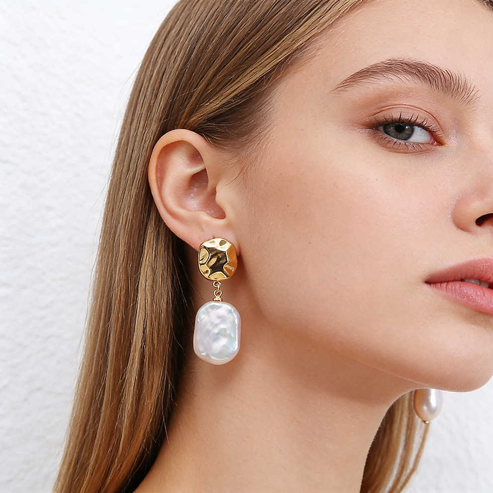 Thumbnail: Woman wearing gold square and baroque pearl drop earring