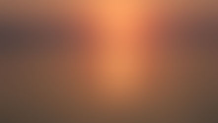 A lone man in a small fishing boat in the sunset