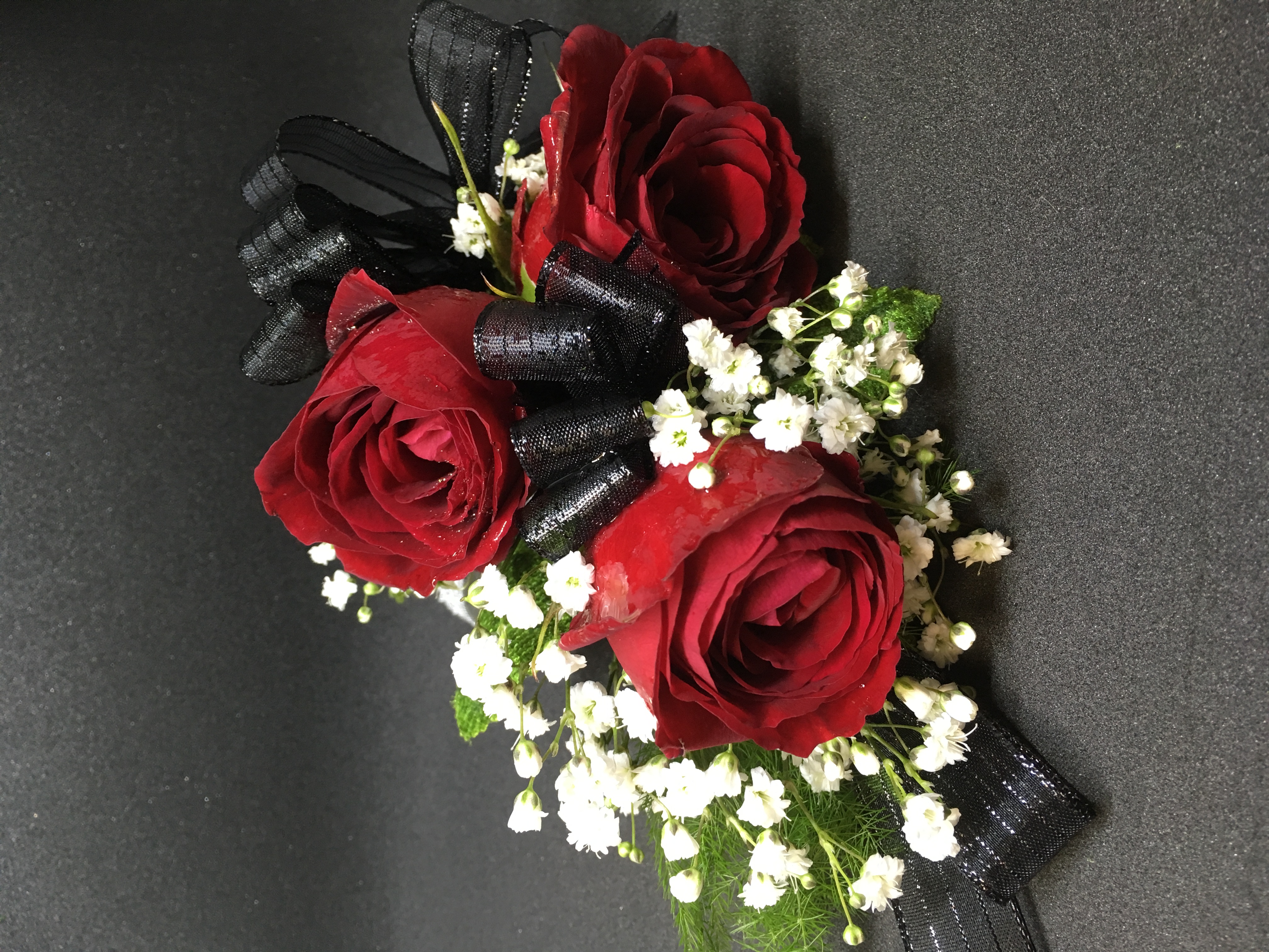 Red roses and black ribbon