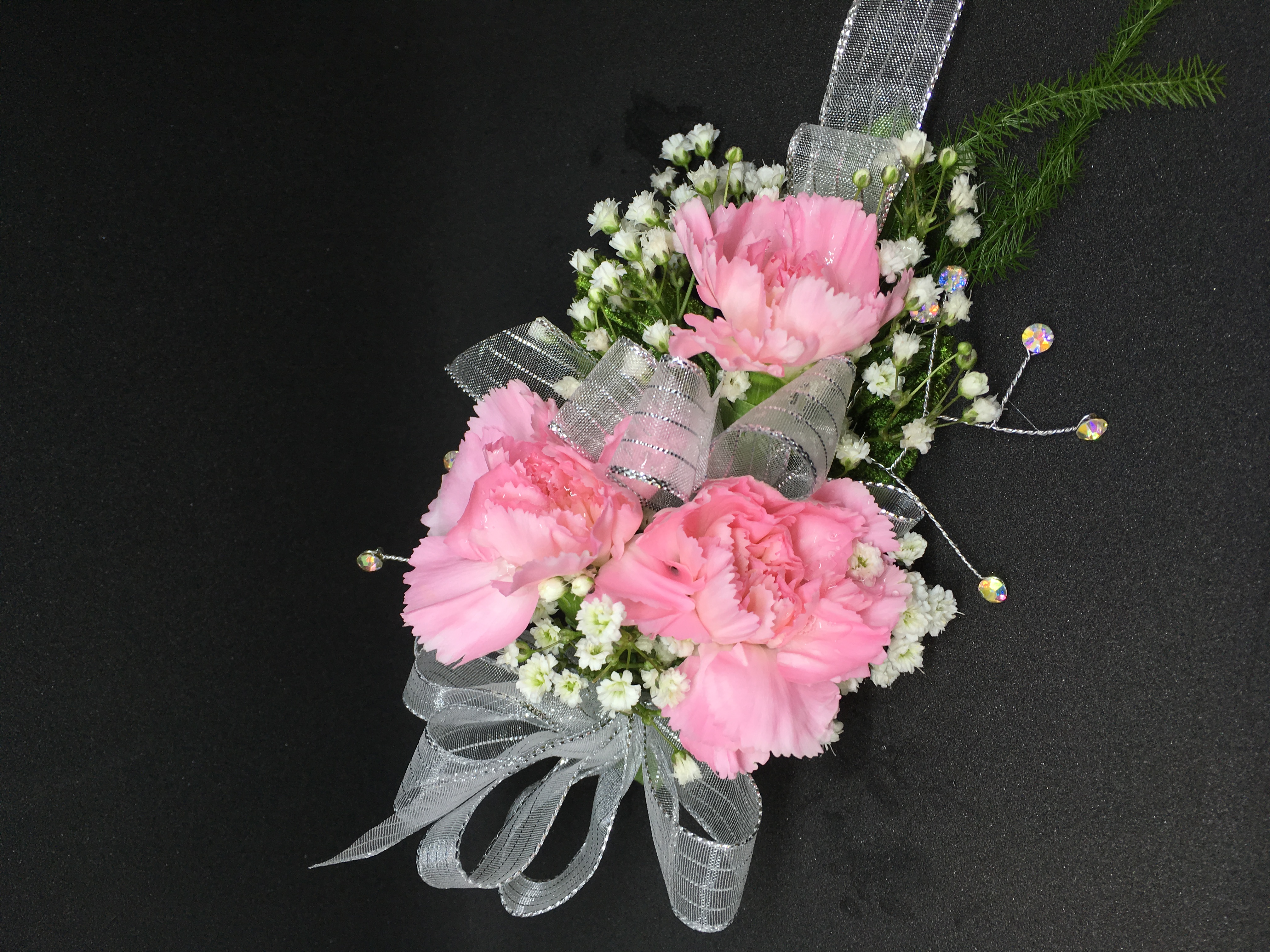 Pink minicarnation corsage