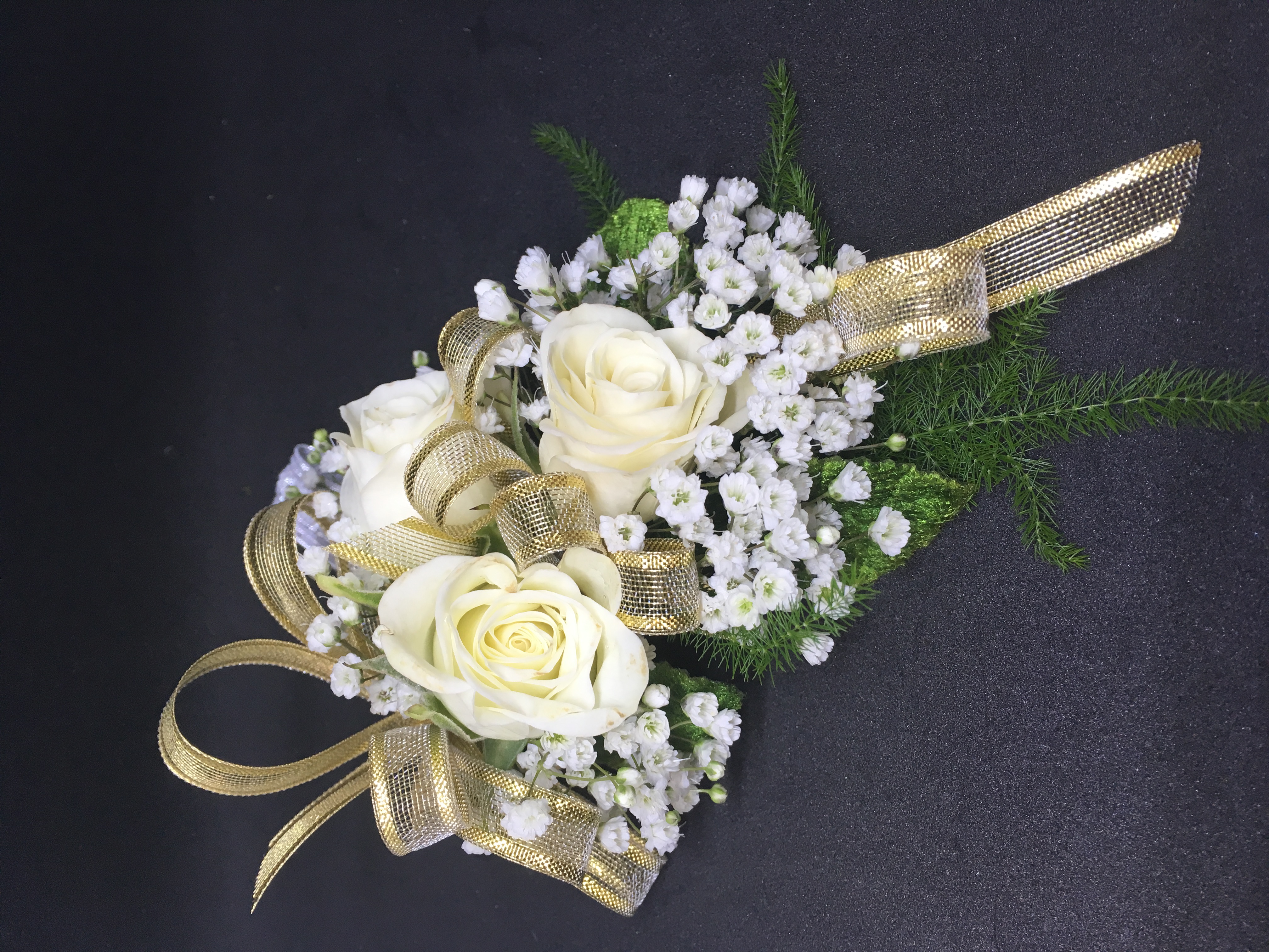 White spray roses and gold ribbon