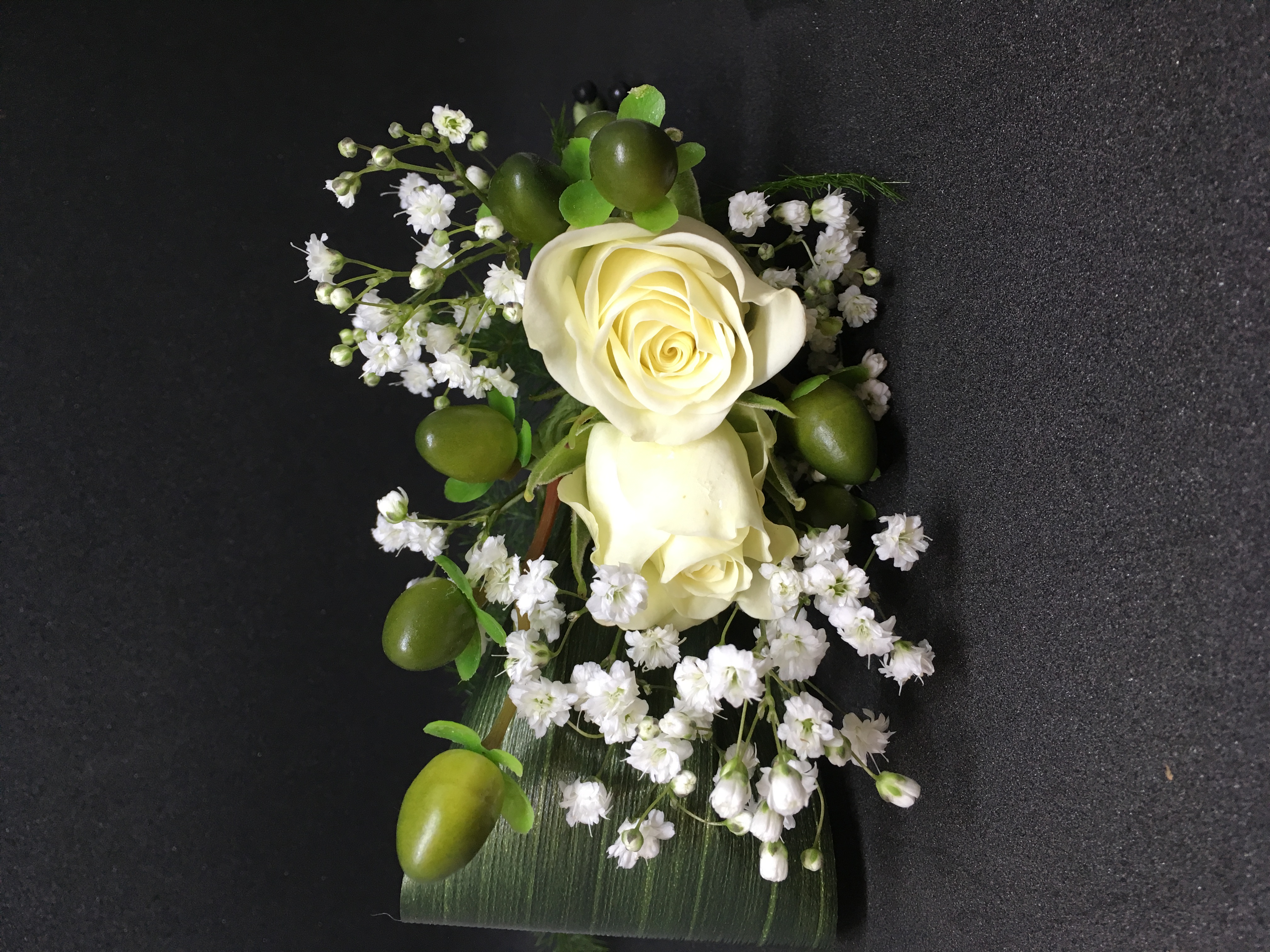Spray rose and berries boutonniere