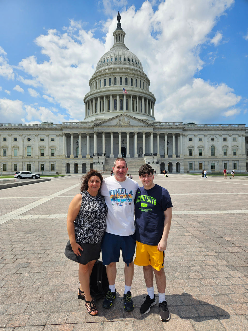 Family standing in the back of the US Capitol