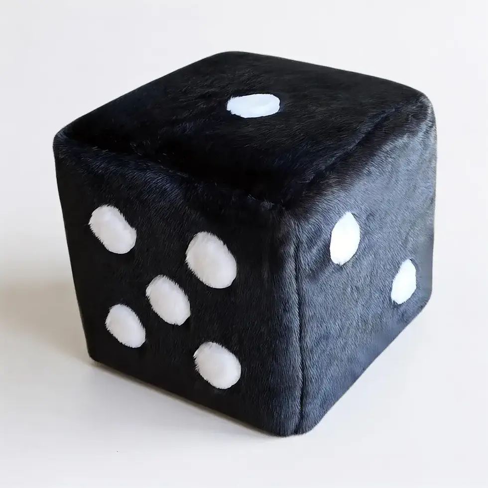 Black faux fur dice-shaped ottoman with white spots, viewed from a slight angle.