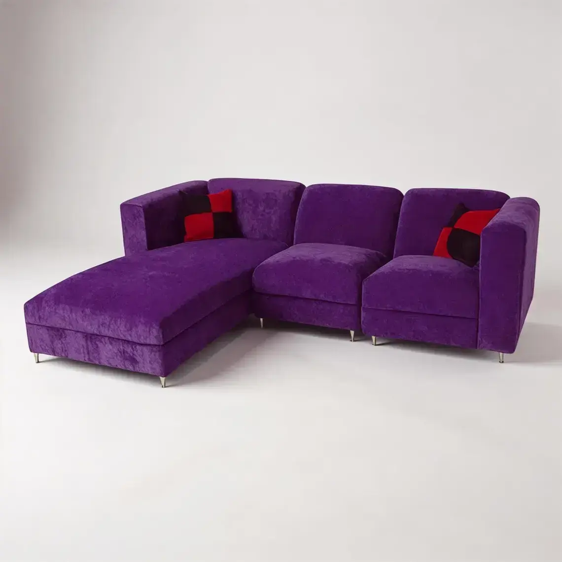 Vibrant purple velvet contemporary sectional, chaise on left. Includes checkered pillows, chrome feet