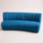 Thumbnail: Teal blue channeled curved banquette with vertical channels on back and horizontal on seat.