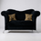 Thumbnail: Picture of a black velvet loveseat with curved arms and animal print pillows