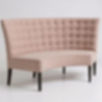 Angled view of the Soirée curved banquette, highlighting the smooth back and fabric texture.