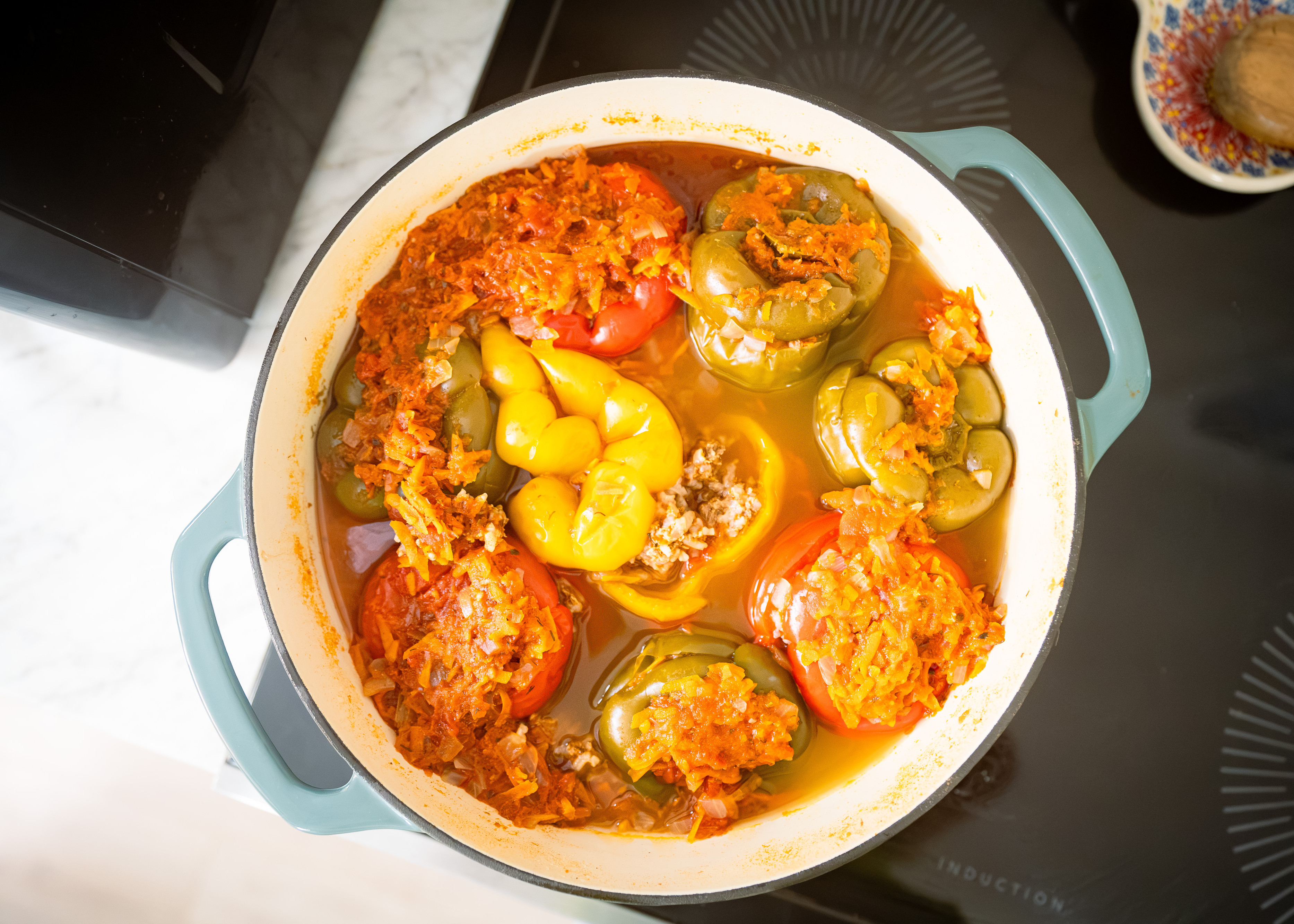Make tender stuffed peppers with beef, pork and rice slowly simmered in homemade tomato sauce