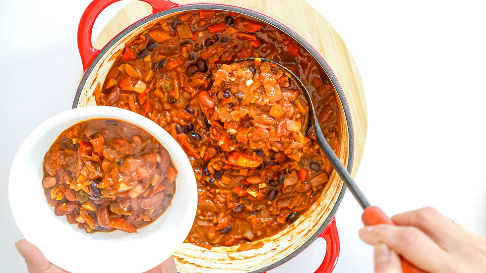 Close-up view of a bowl of vegan chili with beans and vegetables
