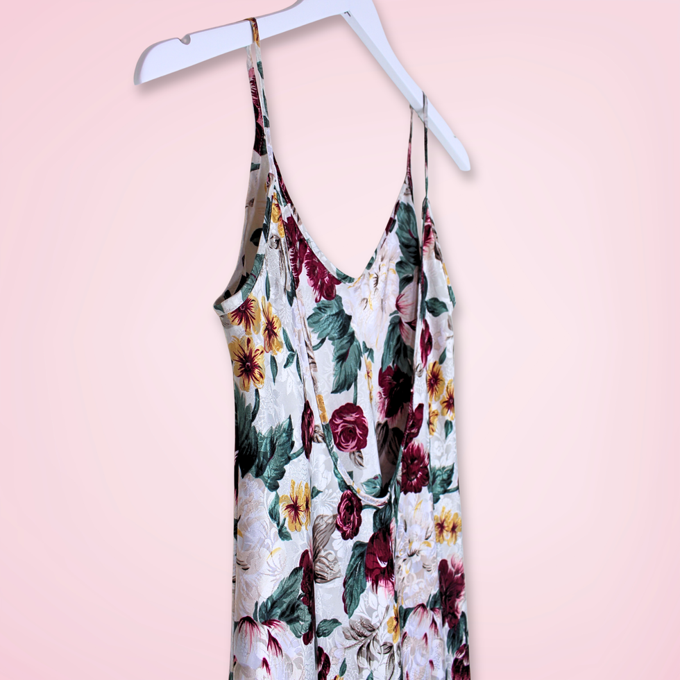 Back left view close up of vintage L.A. Intimates floral slip dress showing low-cut back and flowing satin-like fabric
