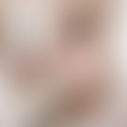 Young woman in a light pink robe standing in a coquette-style bedroom, looking into a vintage dresser drawer filled with colorful bras - symbolizing the connection between lingerie and mood