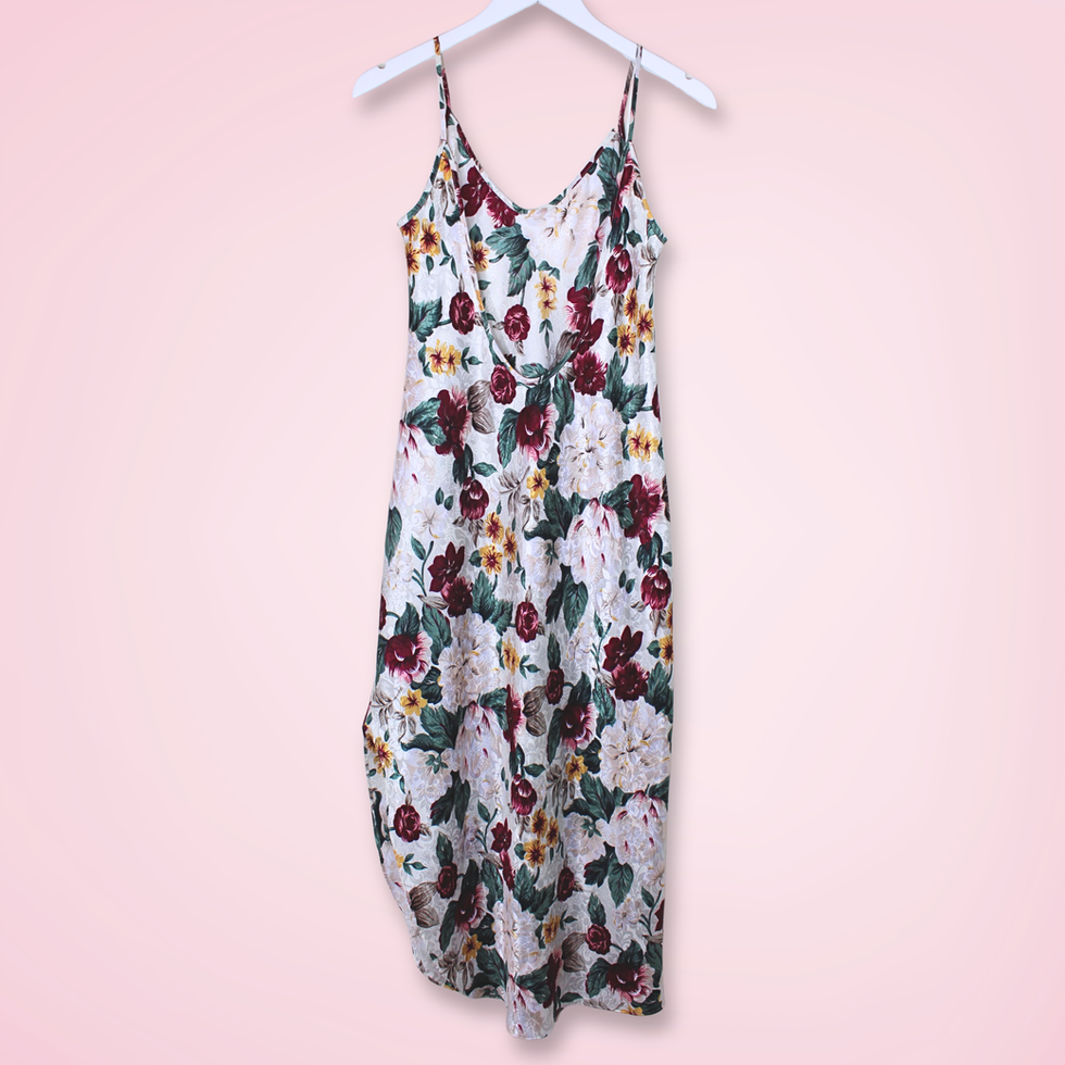Back view of vintage L.A. Intimates floral slip dress showing low-cut back and spaghetti straps