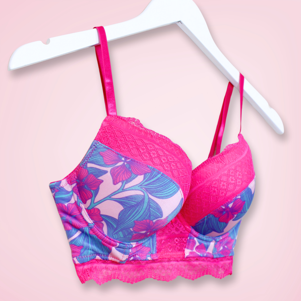 Left front angle of bra showing vibrant floral design and lace-trimmed cups
