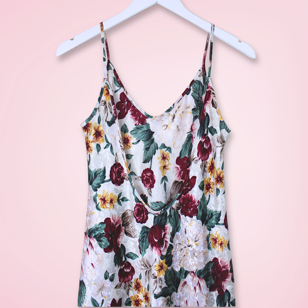 Back view close up of vintage L.A. Intimates floral slip dress showing low-cut back and spaghetti straps