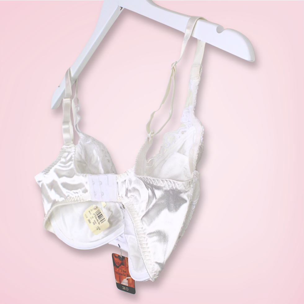 Back right view of vintage Victoria’s Secret Gold Label Miracle Bra with hook and eye closure closed