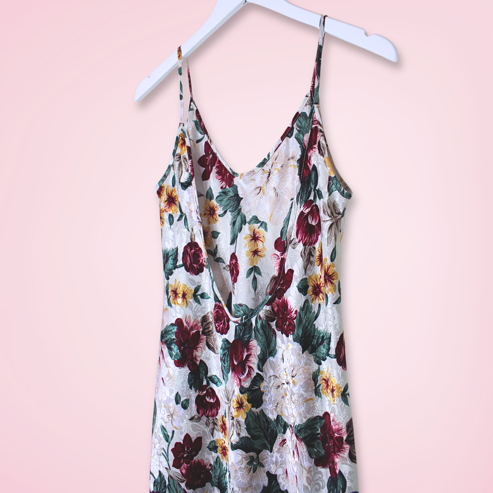 Back right view close up of vintage L.A. Intimates floral slip dress with low-cut back and colorful floral print