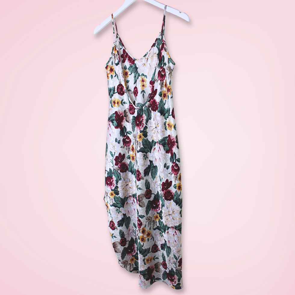 Back right view of vintage L.A. Intimates floral slip dress with low-cut back and colorful floral print