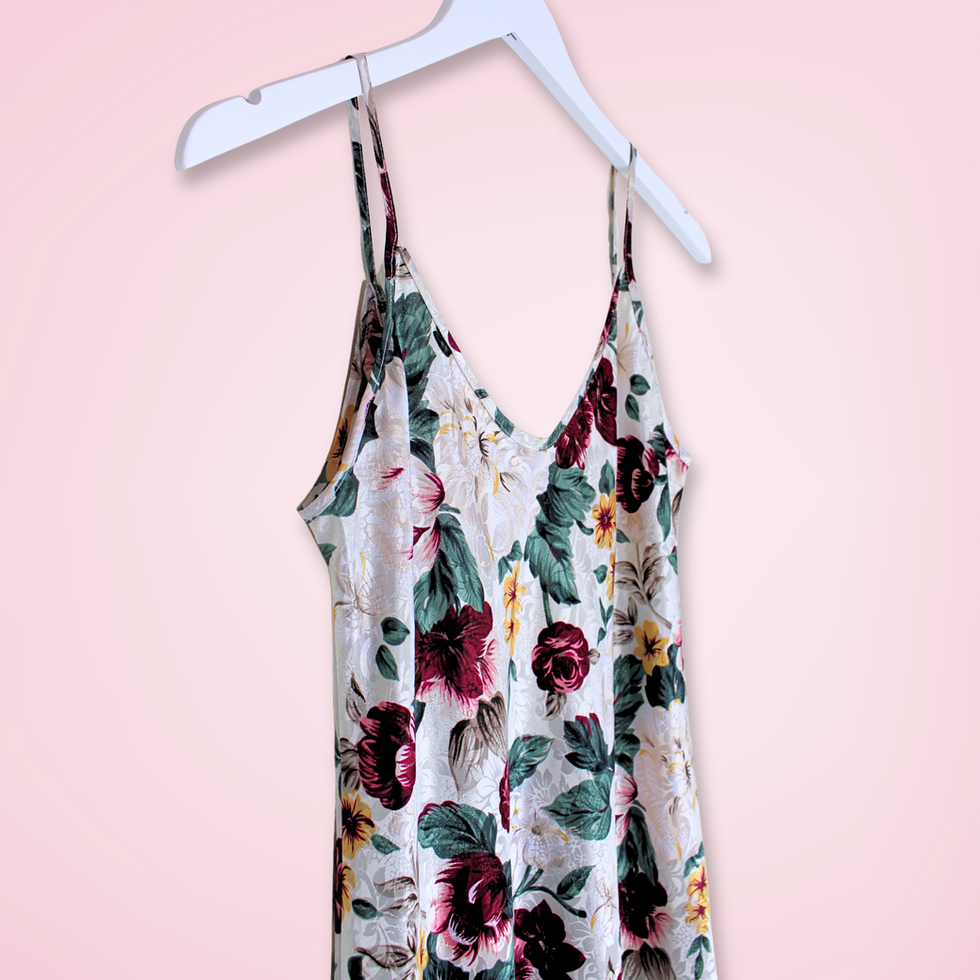 Left front view close up of vintage L.A. Intimates floral satin slip dress showing flowy silhouette and side slit