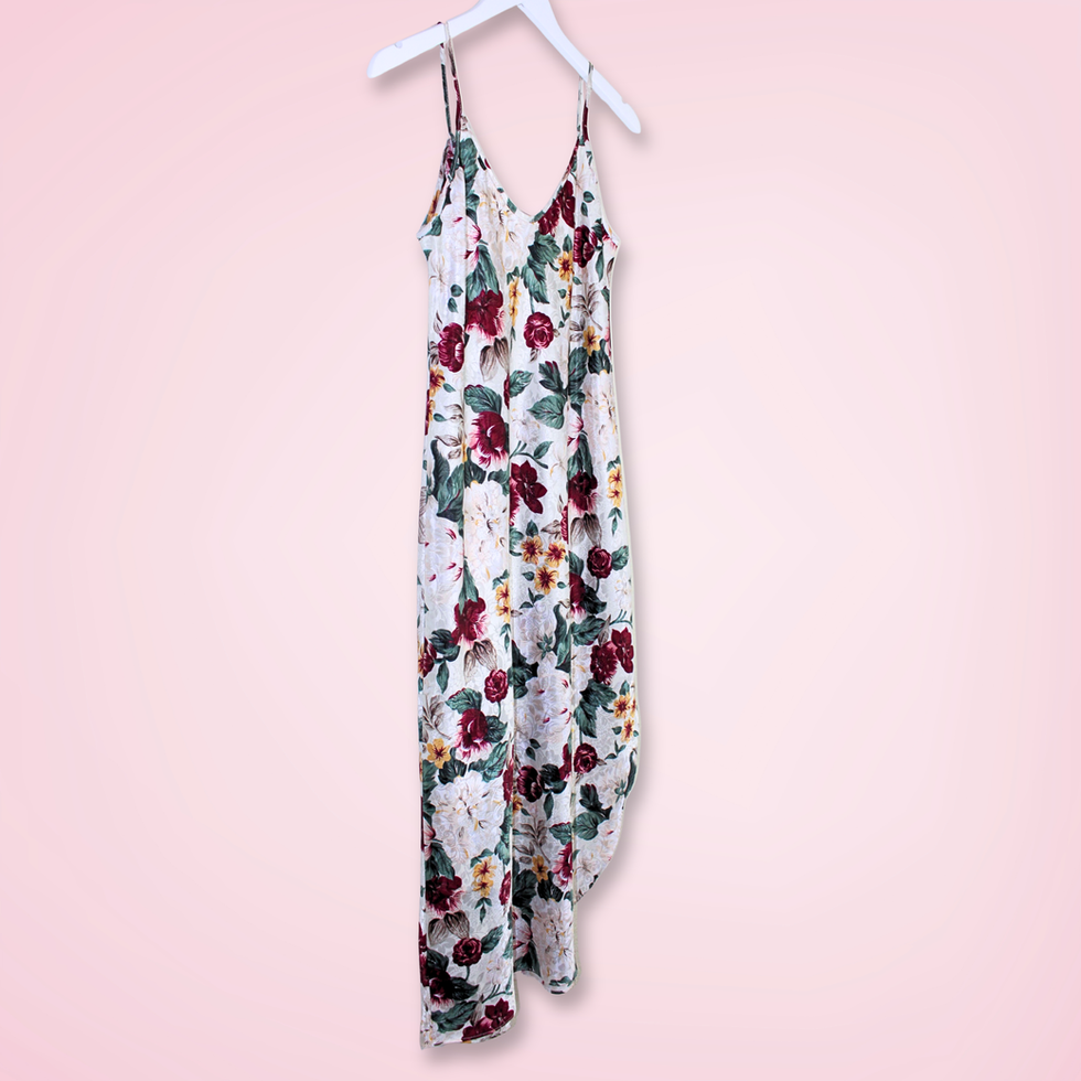 Left front view of vintage L.A. Intimates floral satin slip dress showing flowy silhouette and side slit