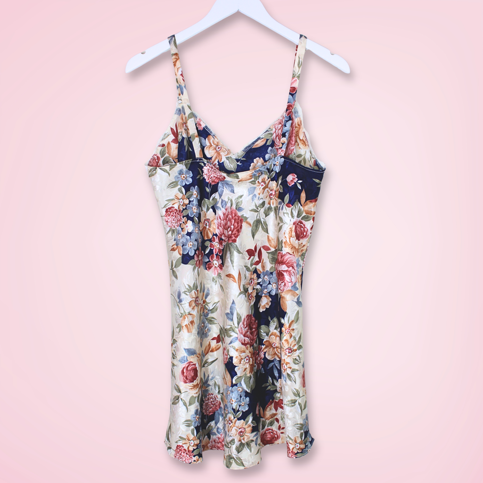 Back view of vintage L.A. Intimates floral slip dress showing colorful floral print and fitted silhouette