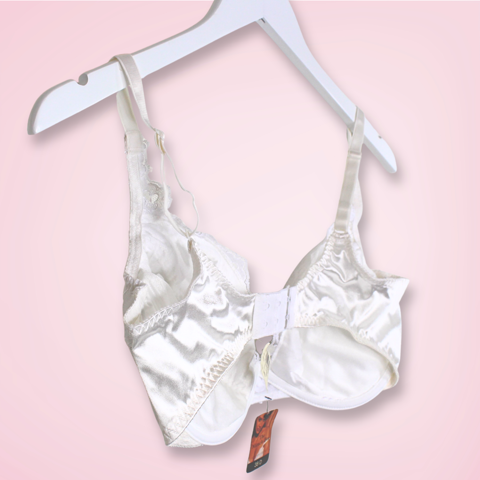 Back left view of vintage Victoria’s Secret Gold Label Miracle Bra with satin band detail