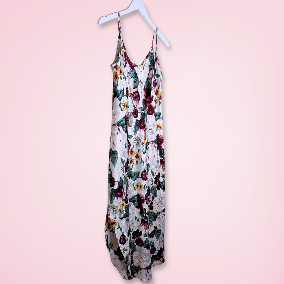 Back left view of vintage L.A. Intimates floral slip dress showing low-cut back and flowing satin-like fabric