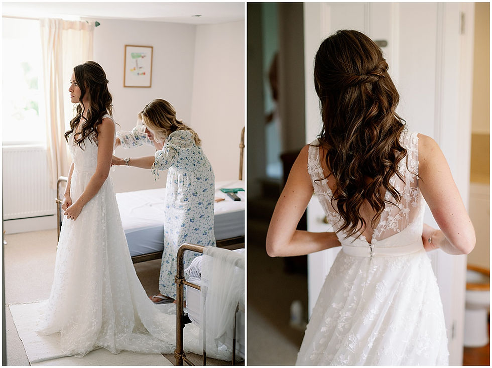Bride getting into her wedding dress for Cotswolds marquee wedding