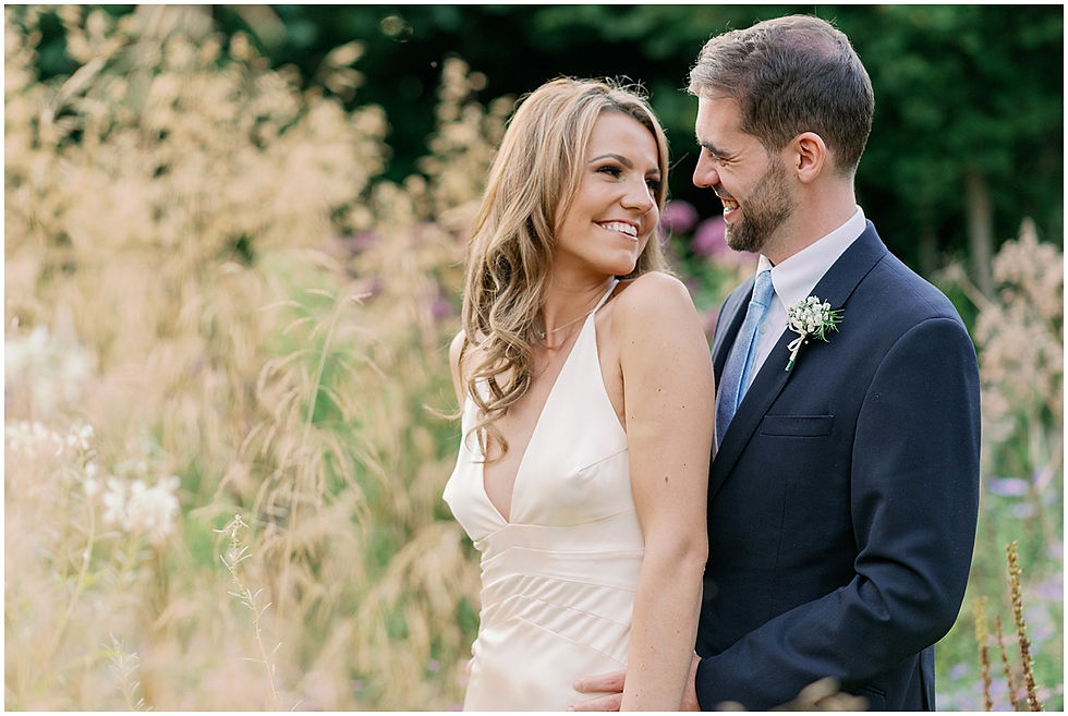 Bride and groom in the gardens of Le Manoir Aux Quat'Saisons wedding