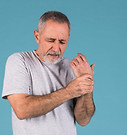 portrait-of-senior-man-holding-his-injur