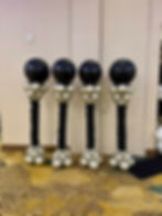 Four black and silver balloon columns in a décor portfolio