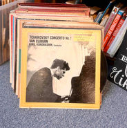 Van Cliburn's Tchaikovsky Piano Concerto No. 1 vinyl record on top of a stack of records