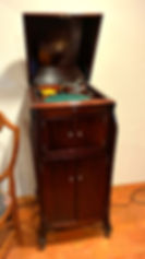A beautiful upright piano and musical items from the home collection.