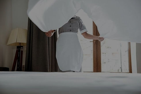 Free Photo _ Hotel maid changing bed sheet_edited.jpg