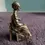 Thumbnail: Right side view of the Royal Hampshire Victorian Woman Sitting In Chair Plated Pewter Figurine