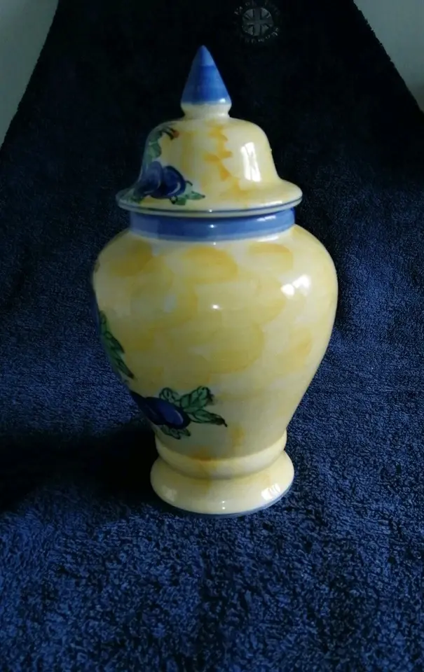 Left side view of the Quimper Style Storage Jar with a Grape Vine Design