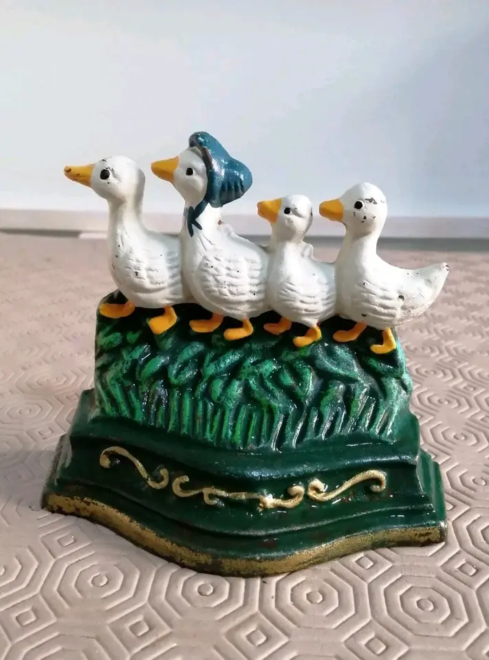 Front view of the Cute Little Cast Iron Door Stop Depicting 4 Ducks Going For A Waddle