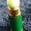 Thumbnail: Angled top front view of the Rondo Saville Gun Cartridge Perfume in a Green Case