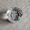 Thumbnail: Angled top and front view of the 1977 ER Silver Jubilee Clear Glass Round Paperweight