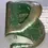 Thumbnail: Angled left side veiw of the Velos 1950s Green Metal Hole Puncher