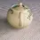 Thumbnail: Rear view of the Japanese Banko Pottery Teapot with white flower and green leaves design